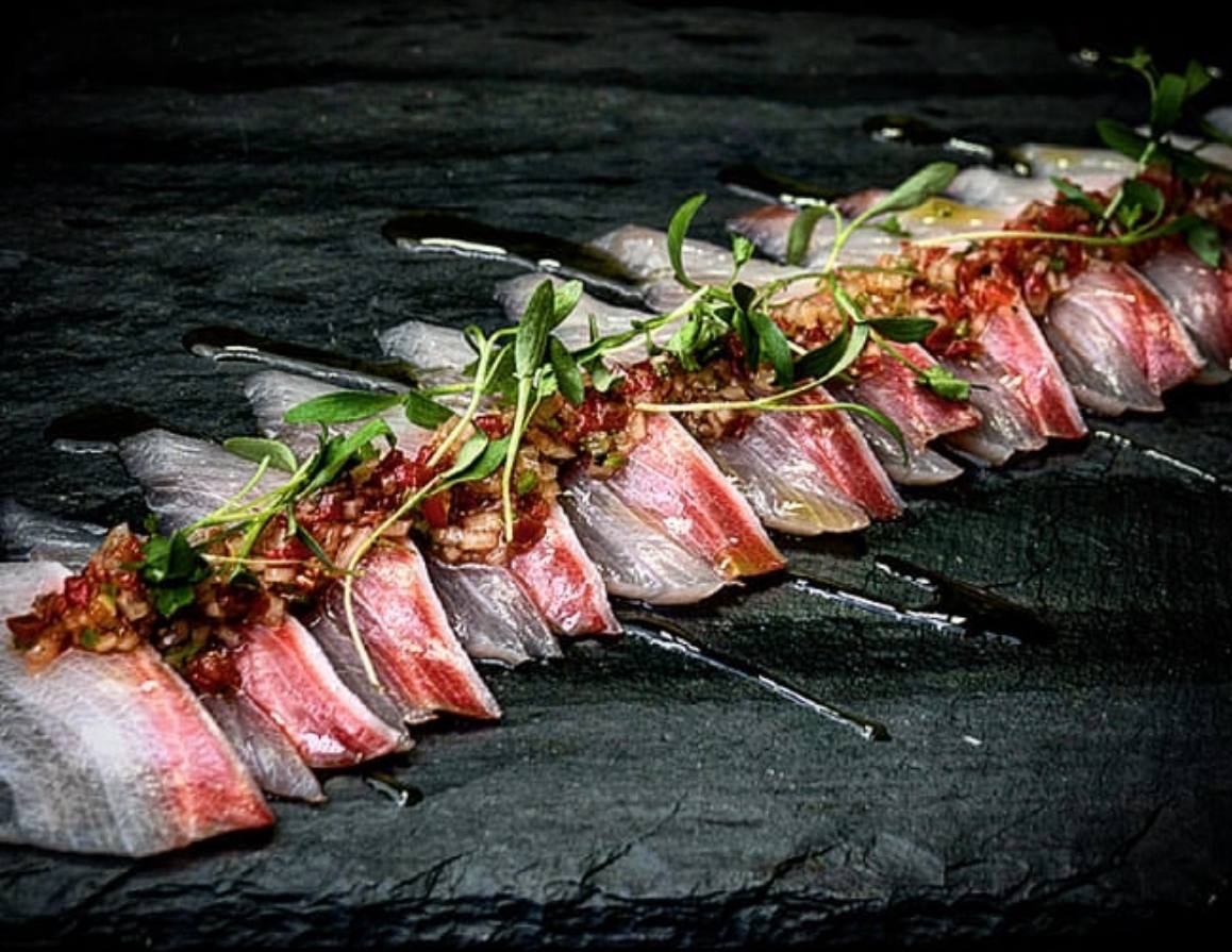 Sashimi with ponzu on slate