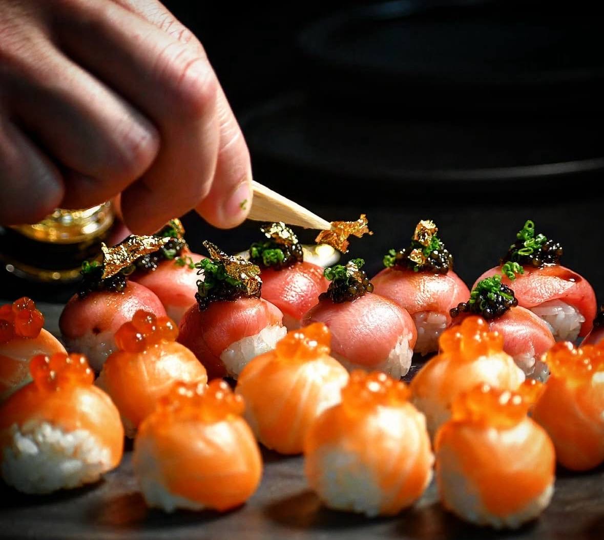Salmon and toro nigiri with gold leaf